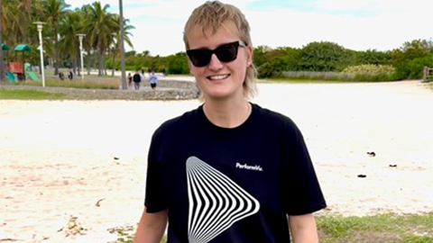 Indy Sanders smiling wearing a t-shirt with PerformVu's Logo on it
